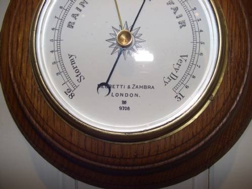 fig 1. solid oak circular aneroid barometer